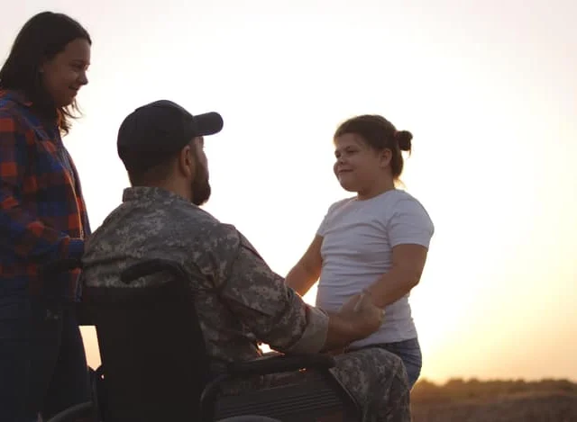 Veteran in wheelchair with family