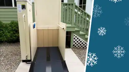 Outdoor vertical platform lift positioned by stairs outside a house, with a graphic of white snowflakes on a teal background beside the image.