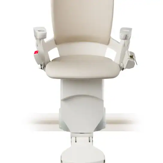A beige and white stairlift chair with armrests and a footrest, mounted on a rail, shown from the front against a white background.